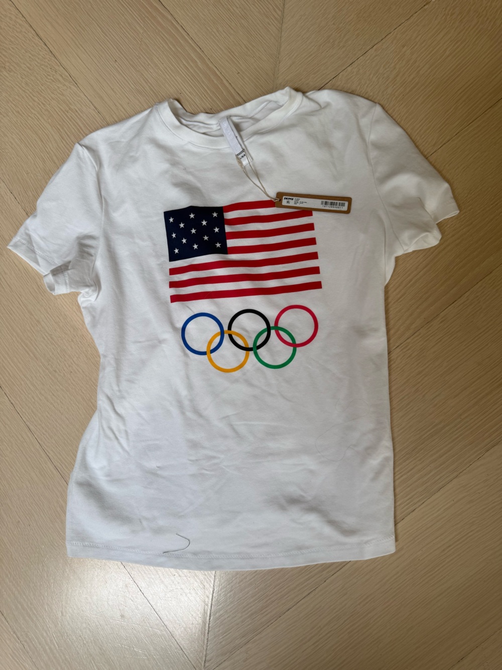 SKIMS White Olympic Rings & USA Flag Graphic Tee